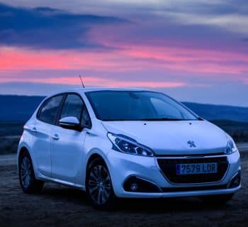 silver honda sedan on brown sand during sunset